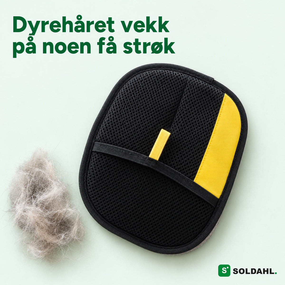Soldahl dyrehårvott med svart nettlomme og gul flik ved siden av en dott kattehår